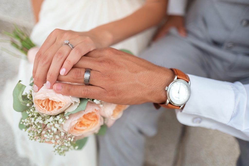 Man and women with wedding rings