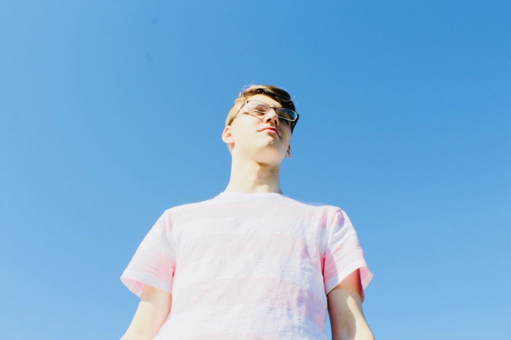 Man standing underneath clear sky
