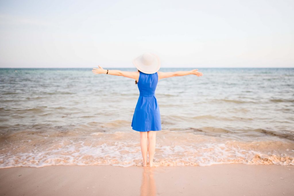 Woman standing in front of the beach